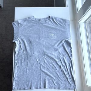 This is a gray long sleeve tee from vans. The size of this shirt is a boys XL.